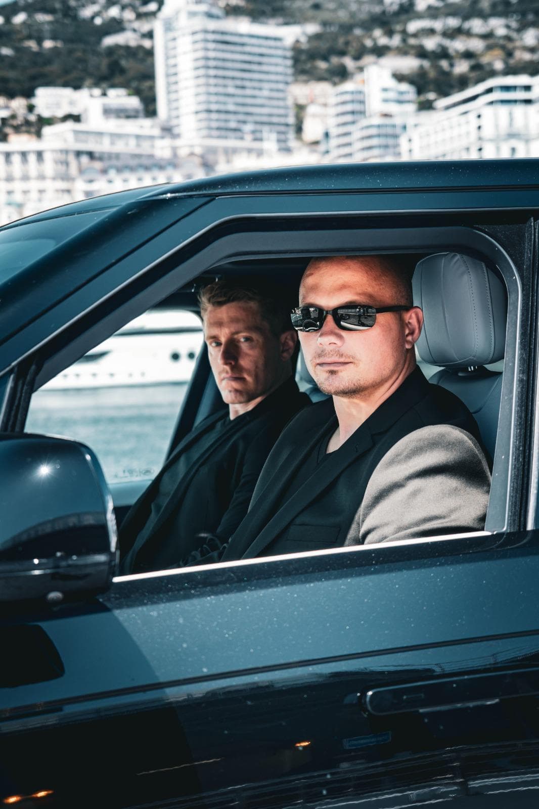 Diplomatic vehicle with protocol flags at Monaco venue